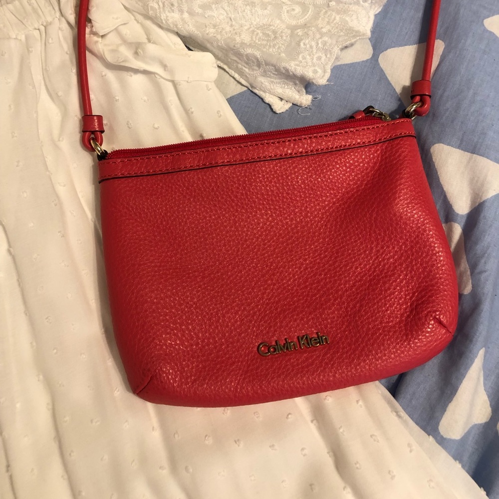 Calvin Klein pebble cross body. Reddish/orange